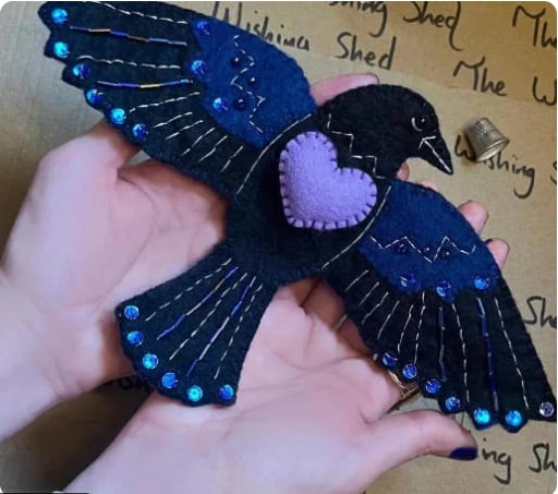 Raven’s Keepsake – Guardian of Stitches”